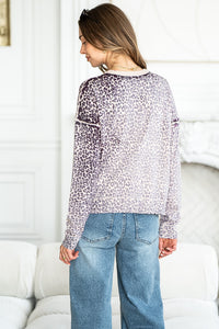 WILD ONE ANIMAL PRINT SWEATER IN PLUM